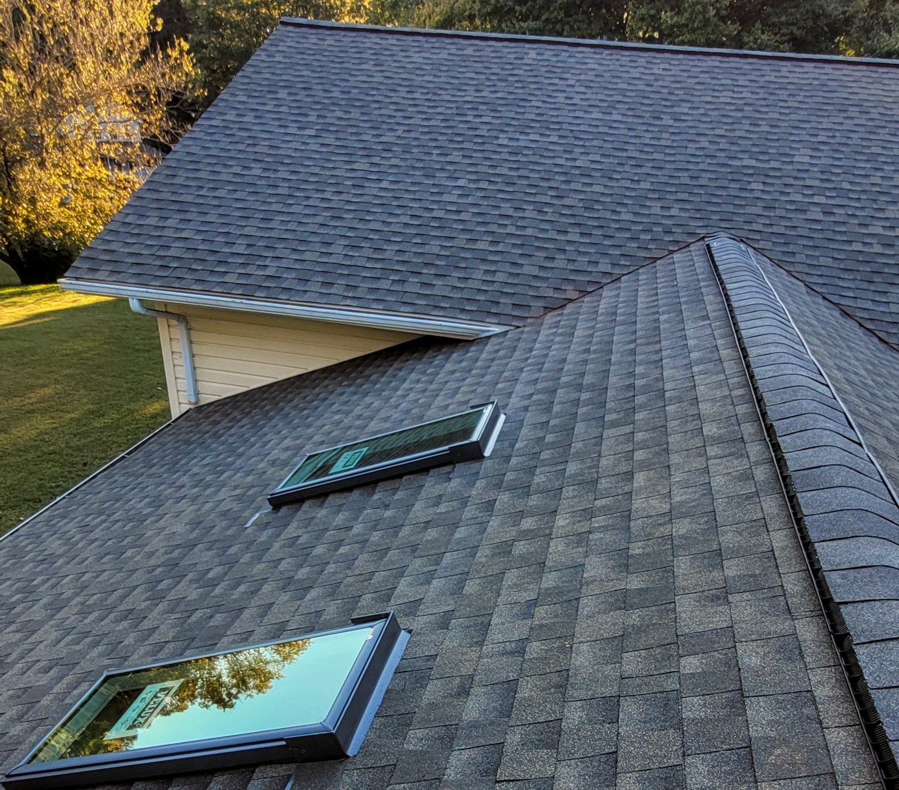 Asphalt Shingle Roof with Skylight Integration – Residential Home